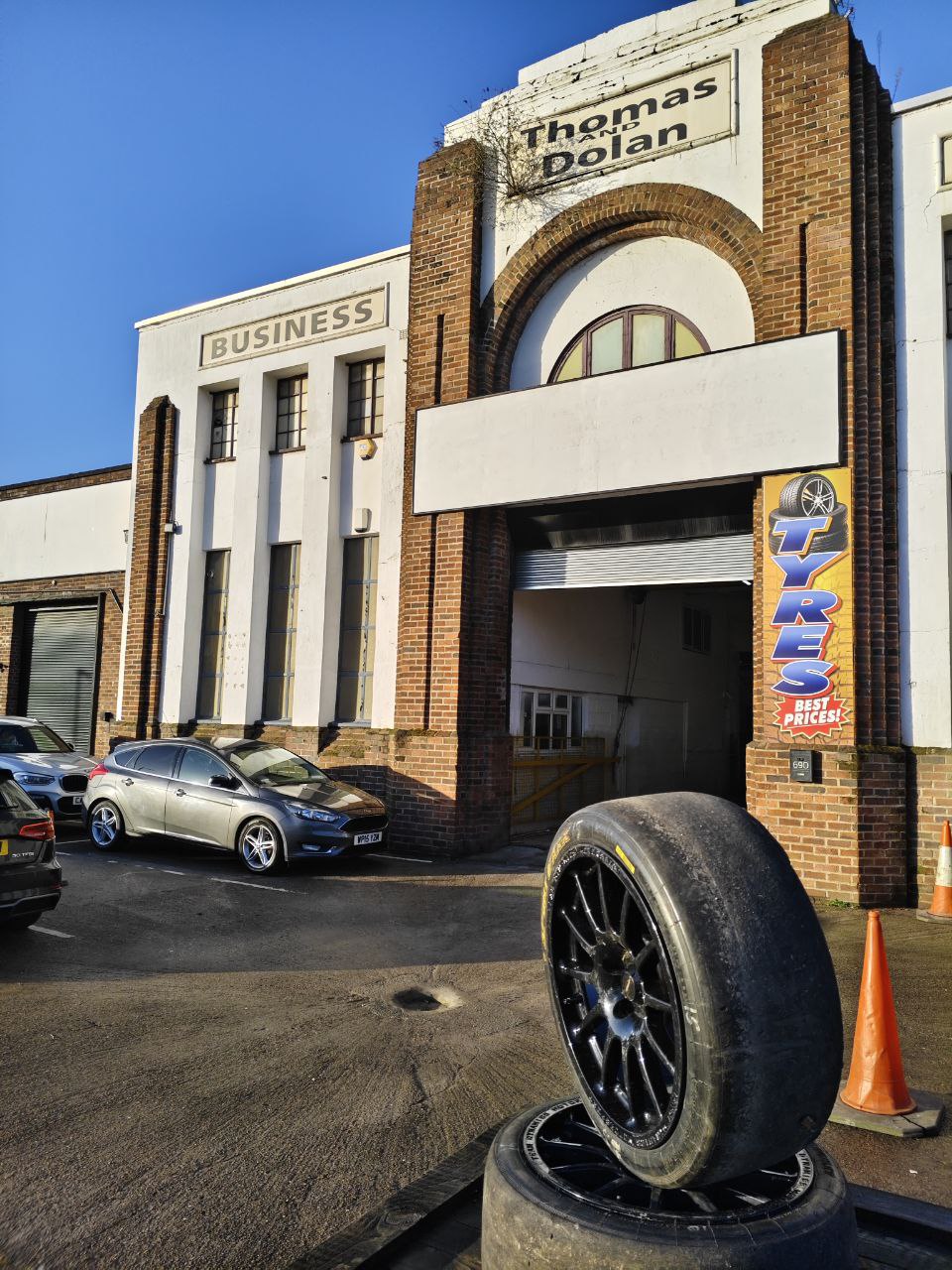 Exterior shopfront with tyre in foreground